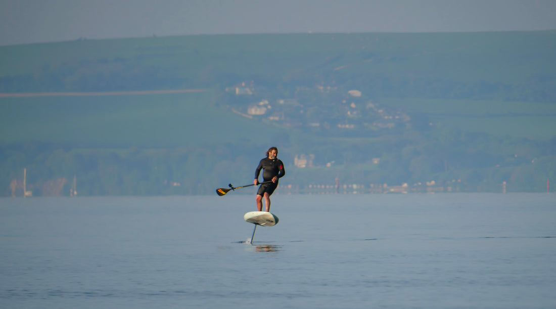 SUP foiling - ESEA Foil foil assist in use.