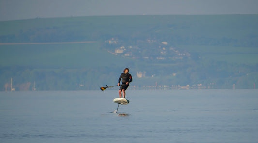 SUP foiling - ESEA Foil foil assist in use.